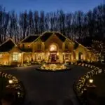 Luxury South Jersey estate and circular drive illuminated with custom warm-white Christmas lights